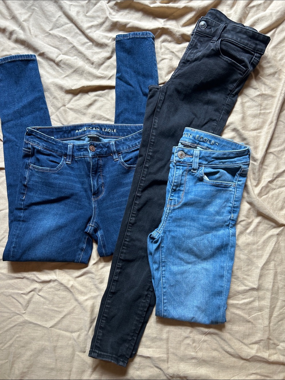 American Eagle Outfitters Skinny Jeans Trio in Dark Blue, Light Blue, and Black - Picture 2 of 7